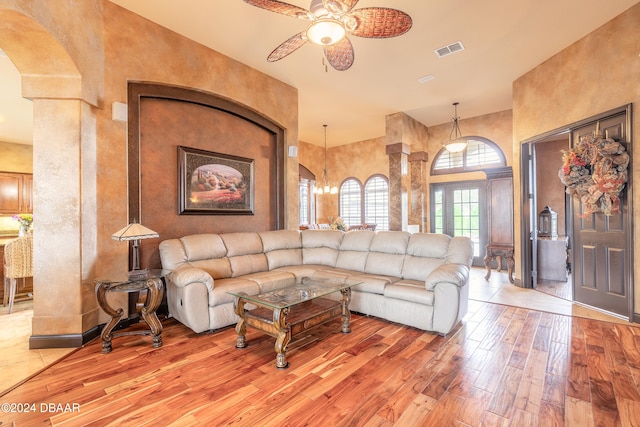 living room featuring hardwood / wood-style flooring and ceiling fan