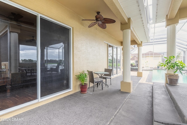 view of patio featuring ceiling fan and a swimming pool