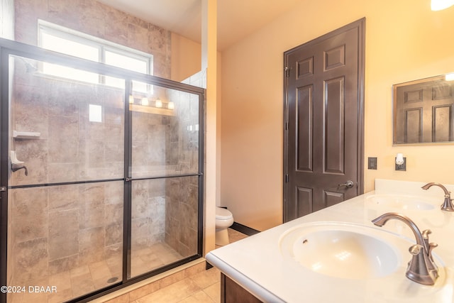 bathroom with tile patterned floors, vanity, toilet, and an enclosed shower