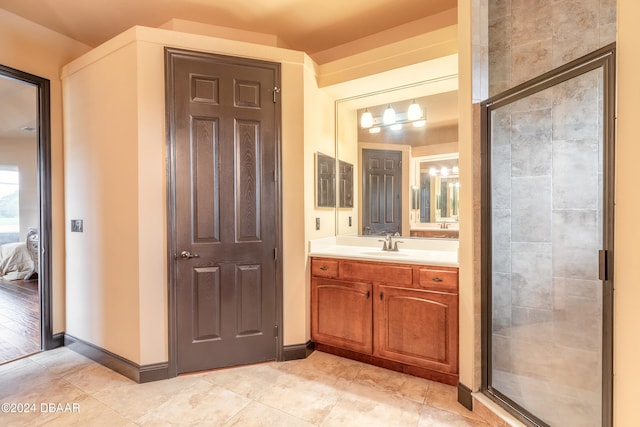 bathroom with hardwood / wood-style floors, vanity, and walk in shower