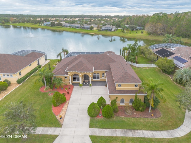 birds eye view of property with a water view