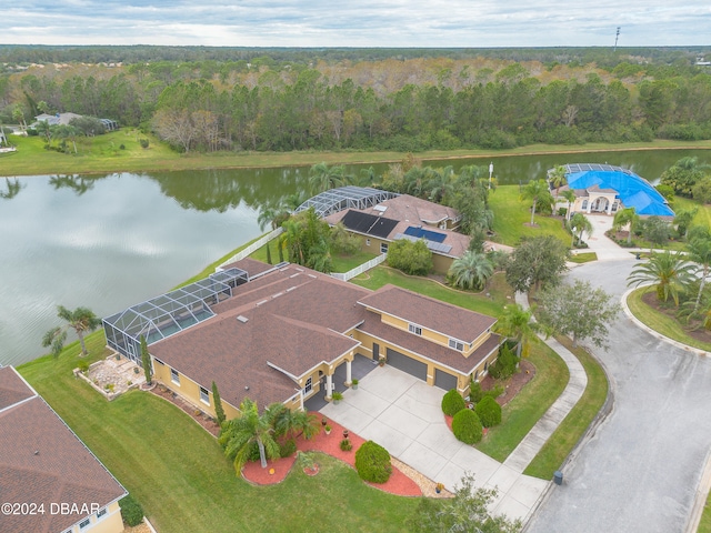 birds eye view of property with a water view