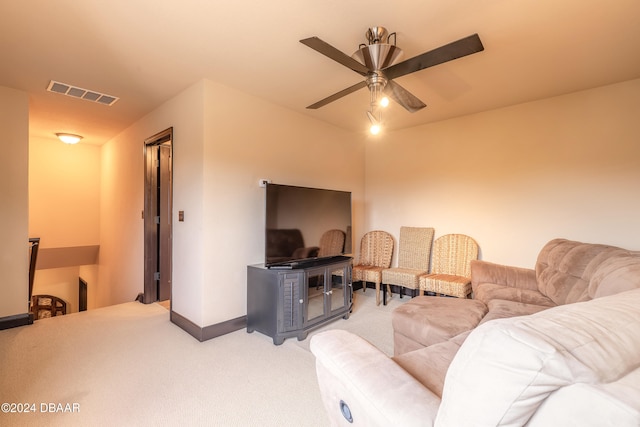 living room featuring carpet and ceiling fan