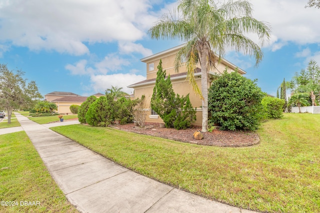 view of side of property with a yard