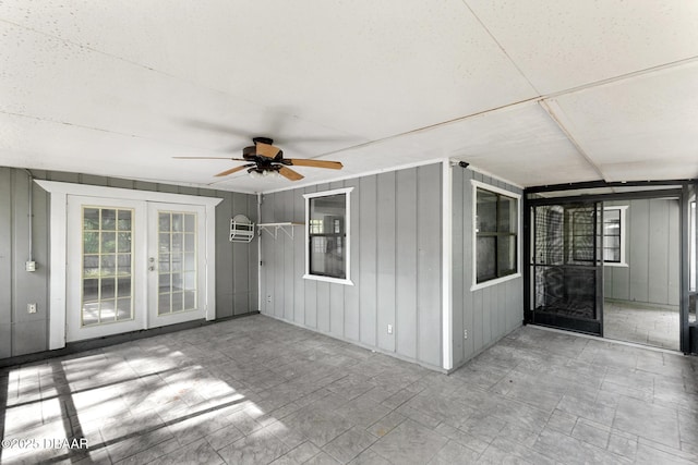 view of patio / terrace with a ceiling fan and a wall mounted air conditioner