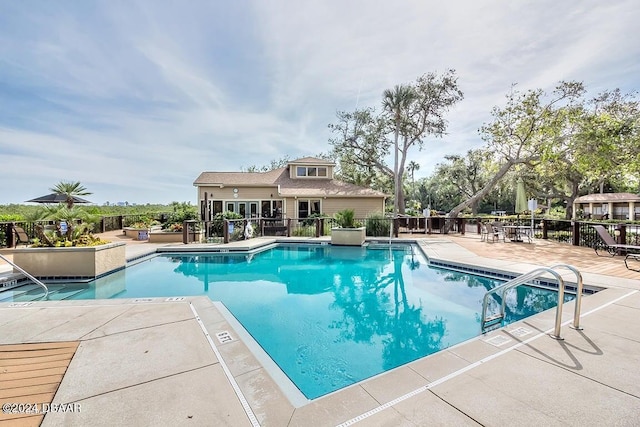 view of pool featuring a patio area