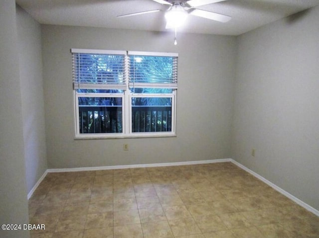 unfurnished room with ceiling fan