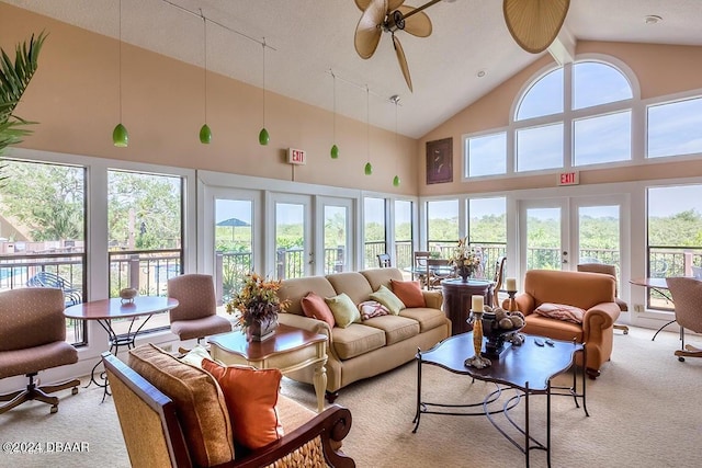 sunroom with vaulted ceiling with beams, ceiling fan, and french doors