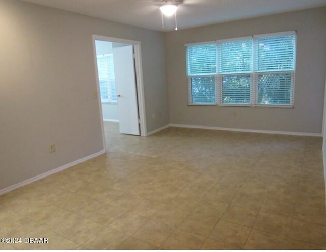 unfurnished room with ceiling fan