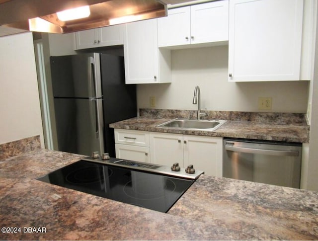 kitchen featuring white cabinetry, appliances with stainless steel finishes, and sink