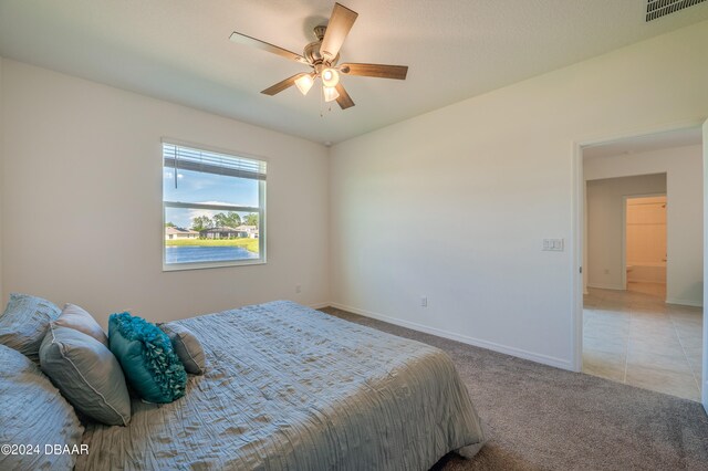 bedroom featuring carpet flooring and ceiling fan