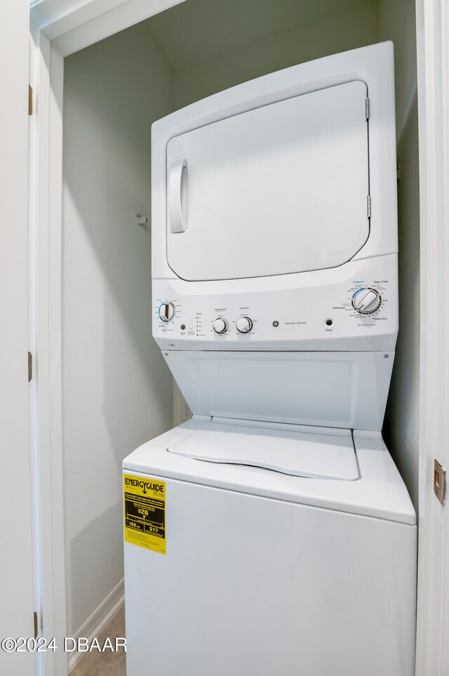 washroom with stacked washer and dryer