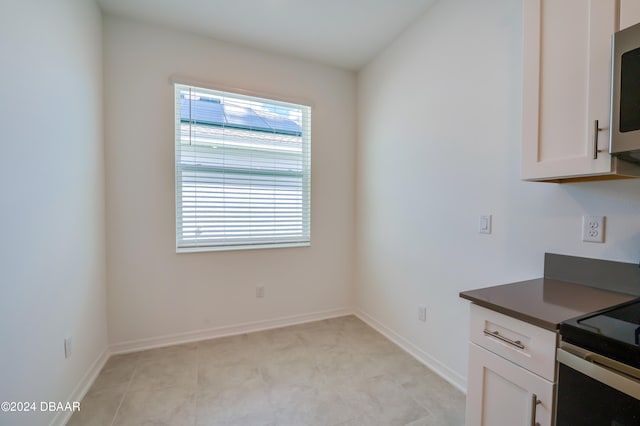 kitchen featuring white cabinetry and stainless steel appliances