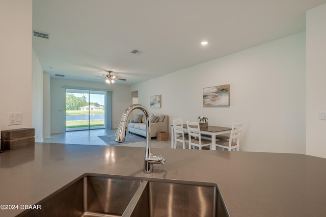 kitchen with ceiling fan and sink