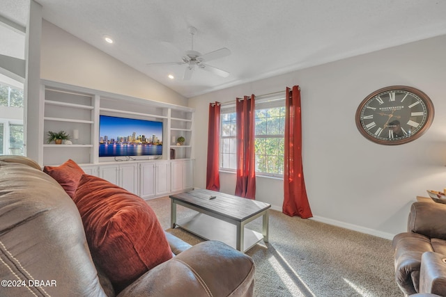 living room featuring carpet flooring, ceiling fan, and vaulted ceiling