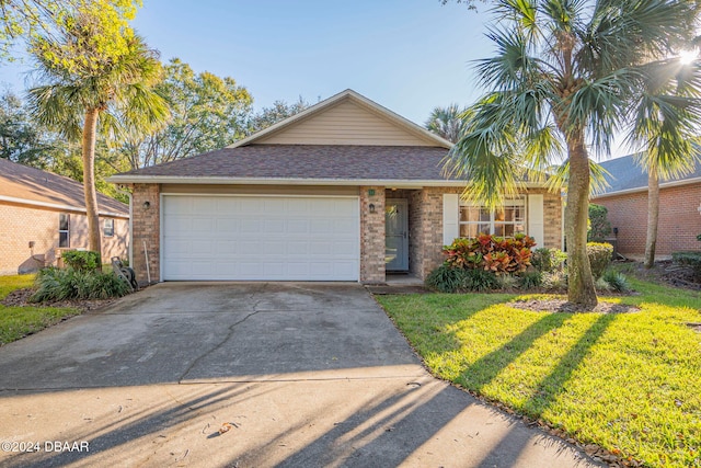 single story home with a front yard and a garage