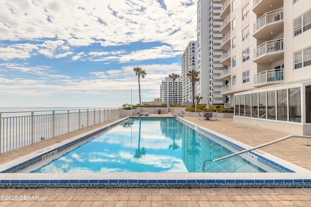 community pool with a water view