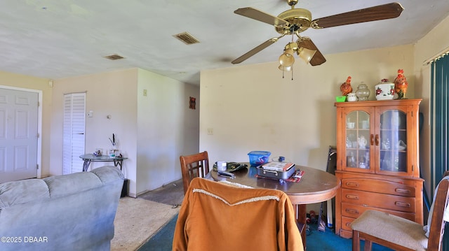 dining area with carpet floors and ceiling fan