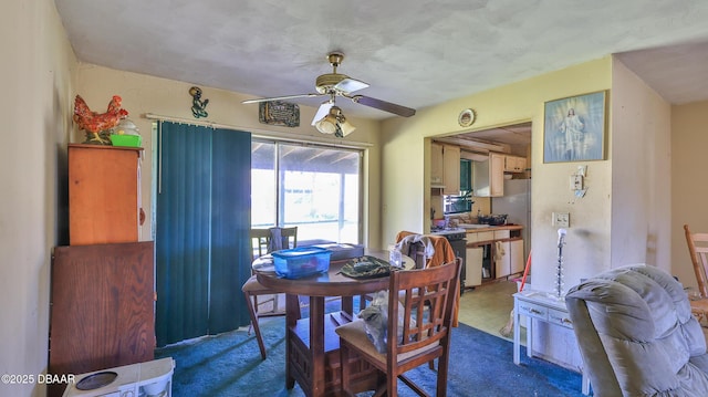 dining room featuring carpet floors and ceiling fan