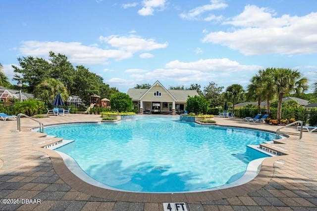 112 Chelsea Place Ave, Ormond Beach, FL 32174 - community pool featuring a patio area