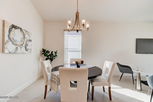 112 Chelsea Place Ave, Ormond Beach, FL 32174 - dining area featuring a chandelier, baseboards, and light tile patterned floors
