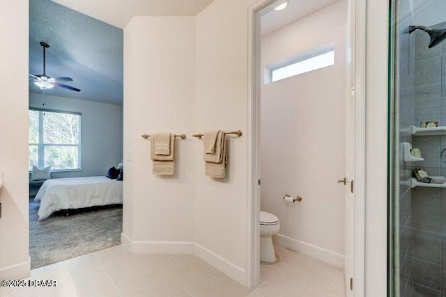 112 Chelsea Place Ave, Ormond Beach, FL 32174 - ensuite bathroom with tile patterned flooring, toilet, a tile shower, and baseboards