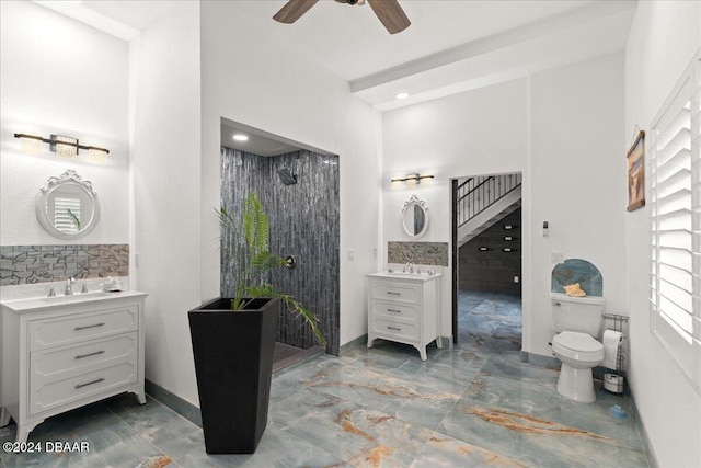 bathroom featuring vanity, walk in shower, and ceiling fan