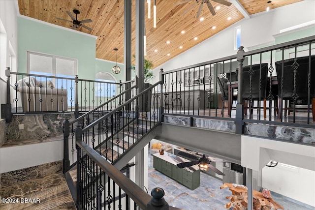 stairs featuring high vaulted ceiling and wooden ceiling