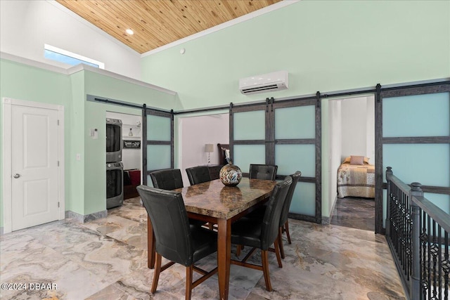 dining room featuring a barn door, wooden ceiling, a towering ceiling, and a wall mounted AC