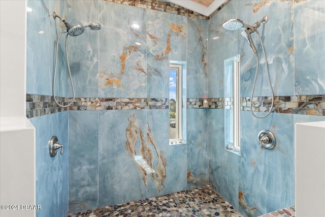 bathroom with a tile shower