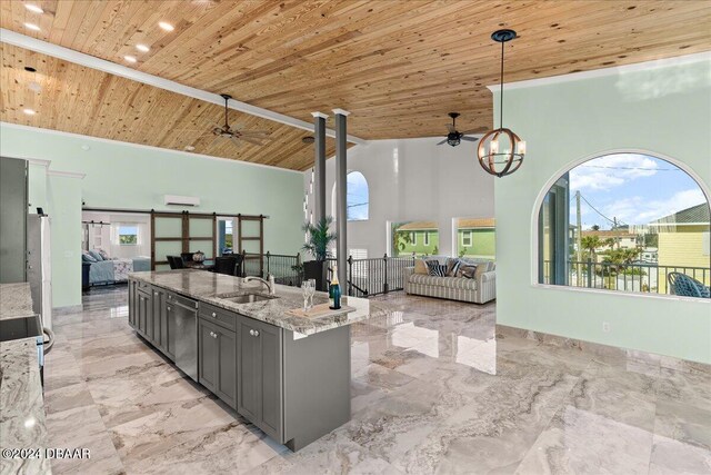 kitchen with light stone counters, hanging light fixtures, high vaulted ceiling, and wooden ceiling