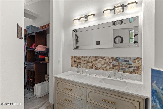 bathroom with decorative backsplash and vanity