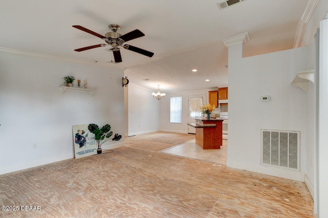 unfurnished living room featuring recessed lighting, ceiling fan with notable chandelier, visible vents, baseboards, and crown molding