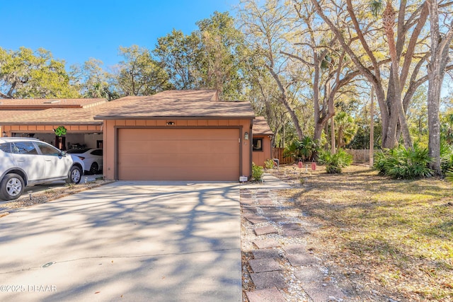 garage featuring driveway