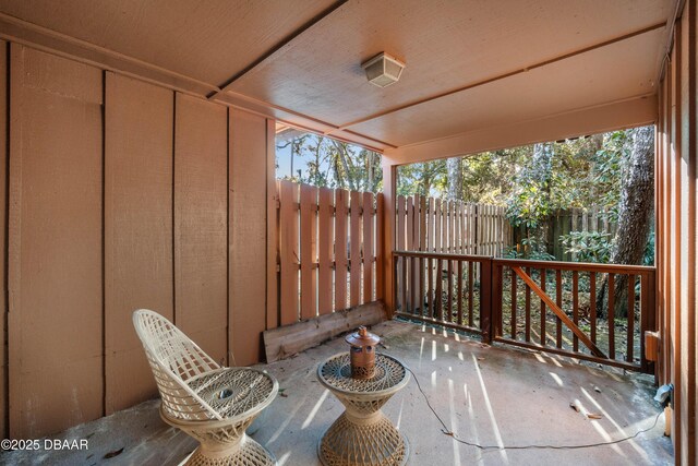 view of patio featuring fence