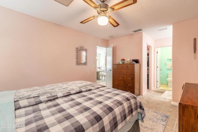 bedroom featuring visible vents, ensuite bathroom, and a ceiling fan