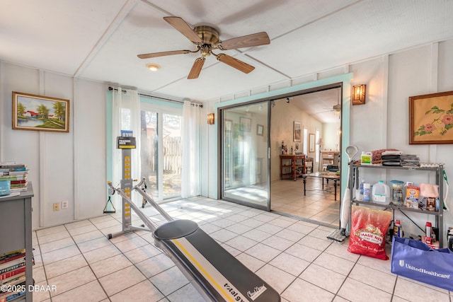 workout room with light tile patterned flooring and a ceiling fan