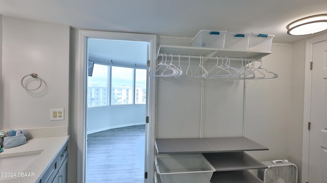 mudroom featuring hardwood / wood-style flooring and sink