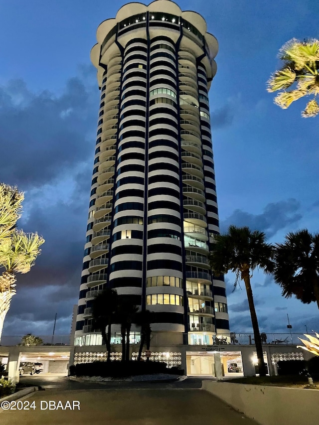 view of outdoor building at dusk