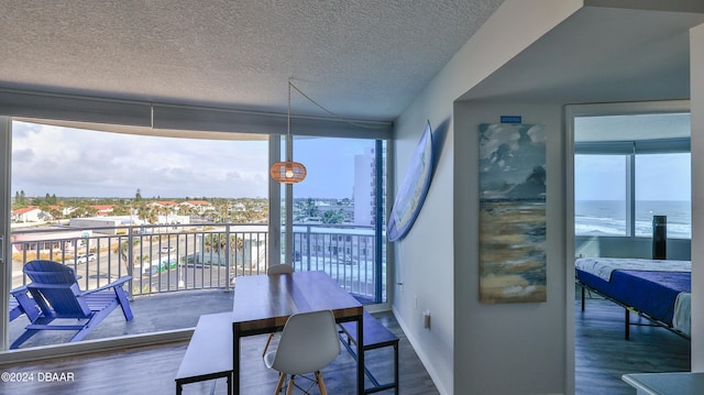 interior space with a wealth of natural light and a water view