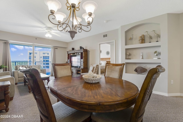 5300 S Atlantic Ave Unit 15-403, New Smyrna Beach, FL 32169 - dining room with light carpet, ceiling fan, a chandelier, built in shelves, and baseboards