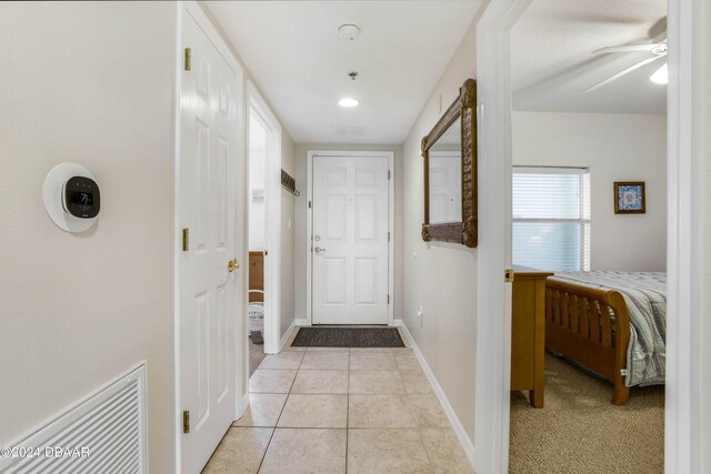 5300 S Atlantic Ave Unit 15-403, New Smyrna Beach, FL 32169 - hall featuring light tile patterned flooring and baseboards