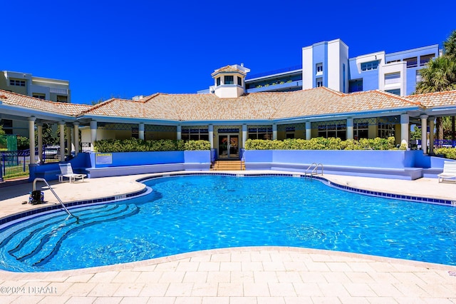 view of swimming pool featuring a patio area