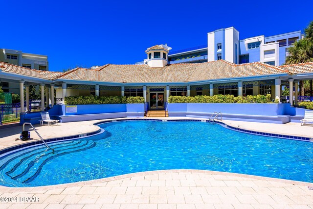 5300 S Atlantic Ave Unit 15-403, New Smyrna Beach, FL 32169 - community pool with french doors and a patio area