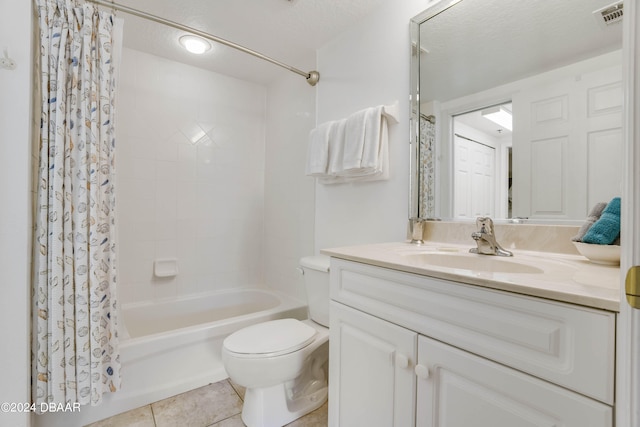 full bathroom with shower / bath combination with curtain, vanity, a textured ceiling, tile patterned flooring, and toilet