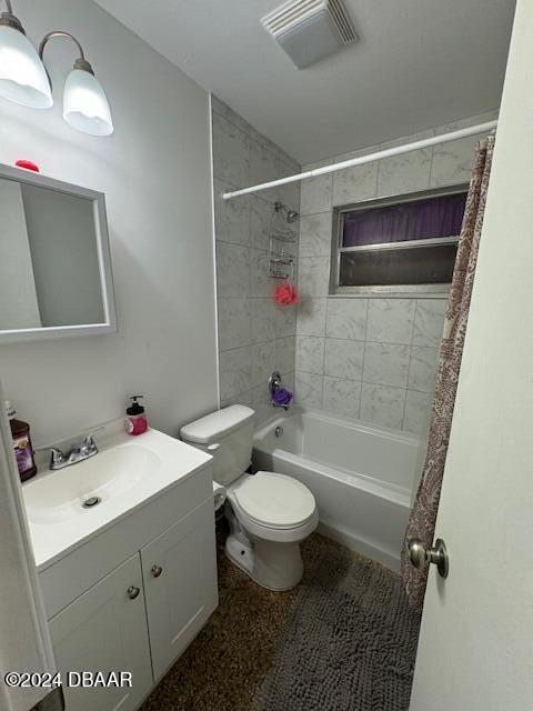 full bathroom featuring vanity, toilet, and shower / tub combo