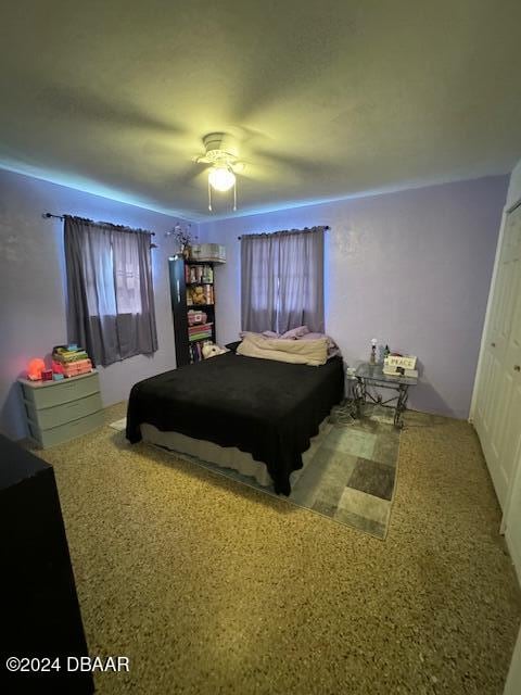 bedroom with a closet and ceiling fan