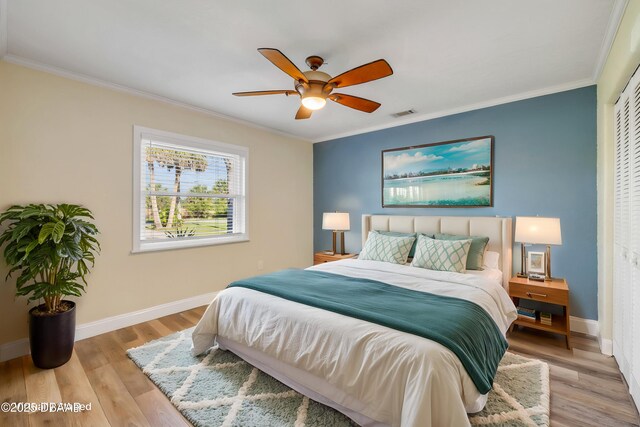 1617 Hontoon Rd, Deland, FL 32720 - bedroom featuring a closet, light wood-style flooring, baseboards, and crown molding