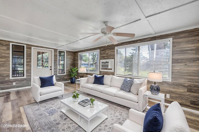 1617 Hontoon Rd, Deland, FL 32720 - living area with wood walls, wood finished floors, and ceiling fan