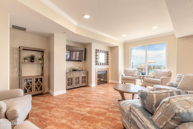 2515 S Atlantic Ave Unit 703, Daytona Beach, FL 32118 - living area featuring a tile fireplace, ornamental molding, and recessed lighting